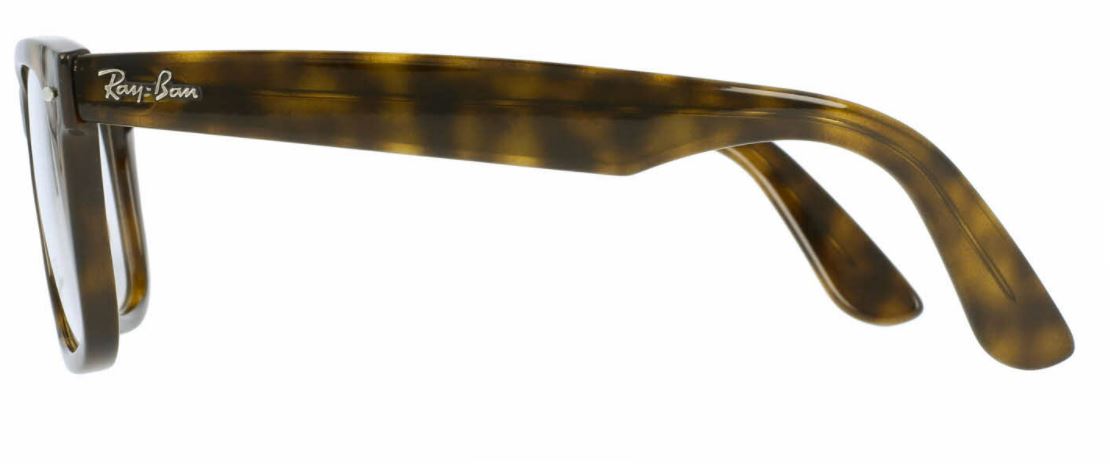 Side view of a tortoiseshell eyeglass arm with a gold detail.