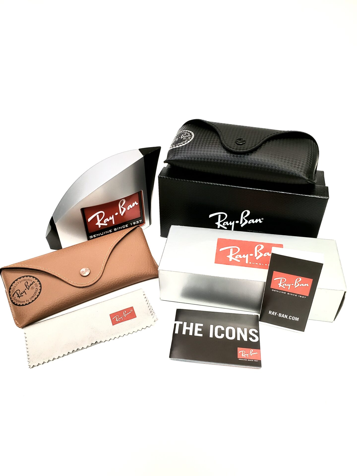 Ray-Ban sunglasses with cases and manuals on a white background.