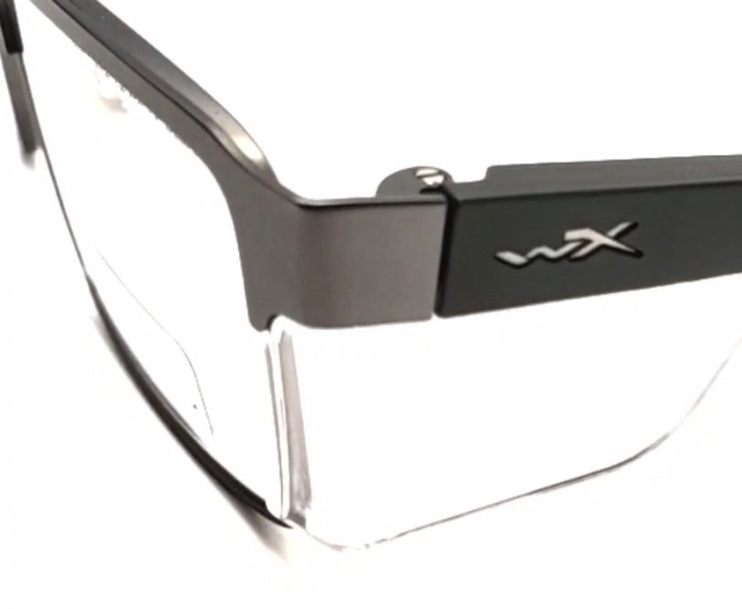 Close-up of sleek, modern eyeglasses with transparent lenses and a matte black frame.